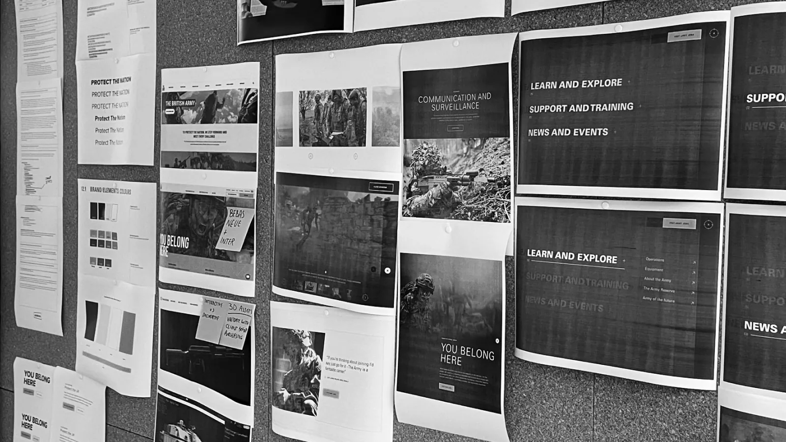 Wireframes and page designs for the British Army website pinned to a wall